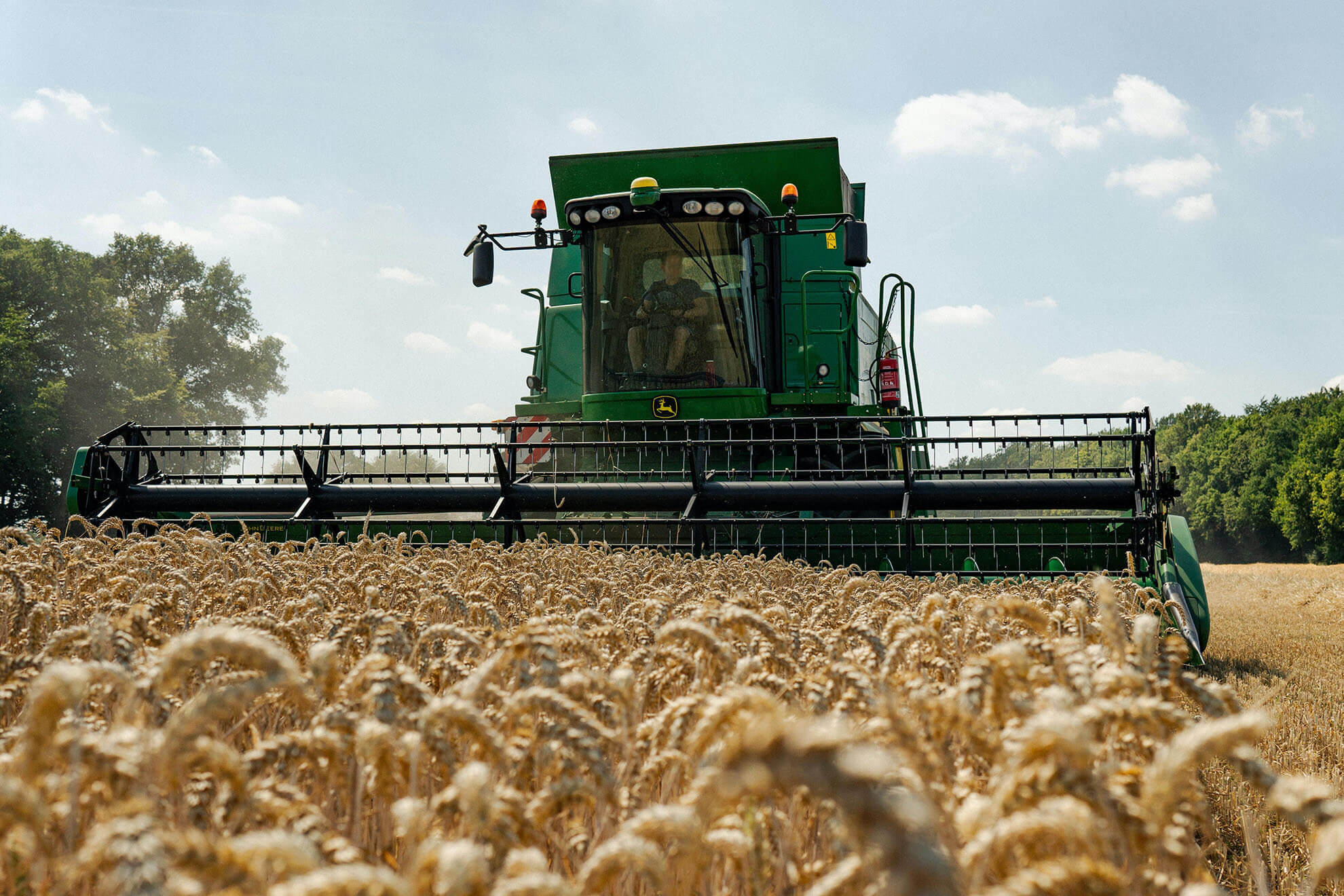 crop field with combine harvester