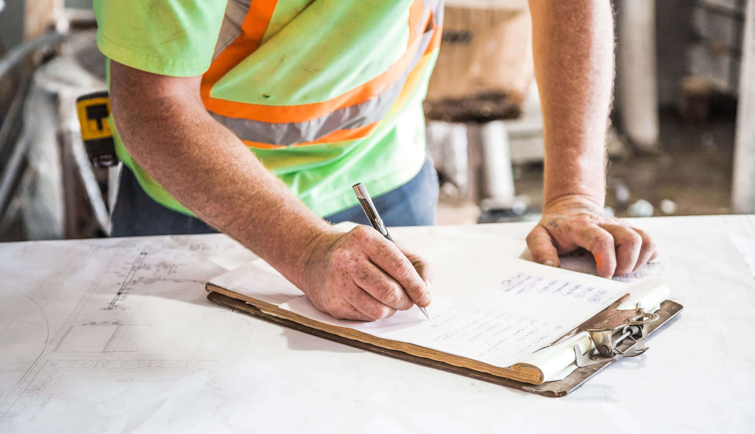 Worker completing a hazard identification checklist