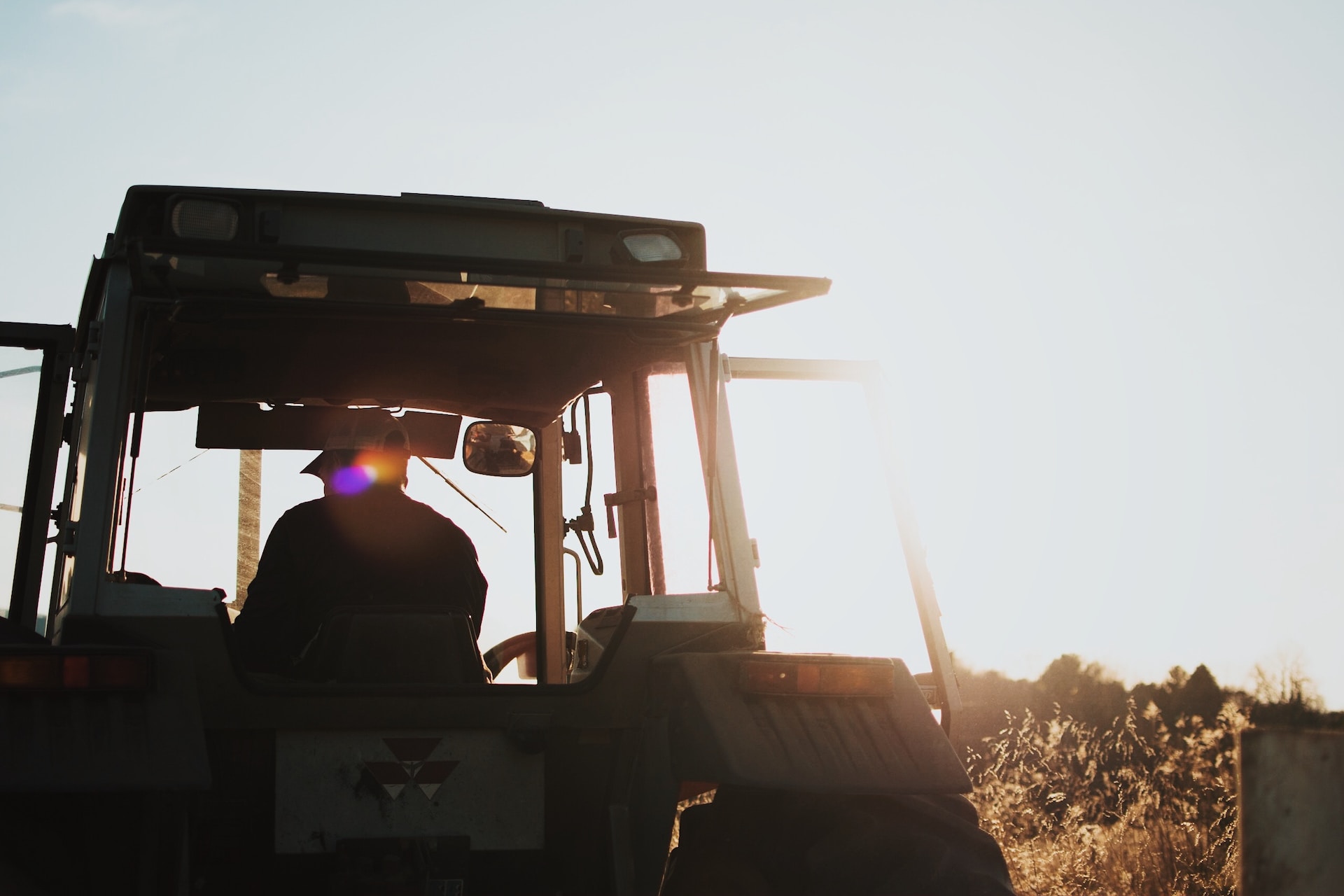farmer and tractor in field